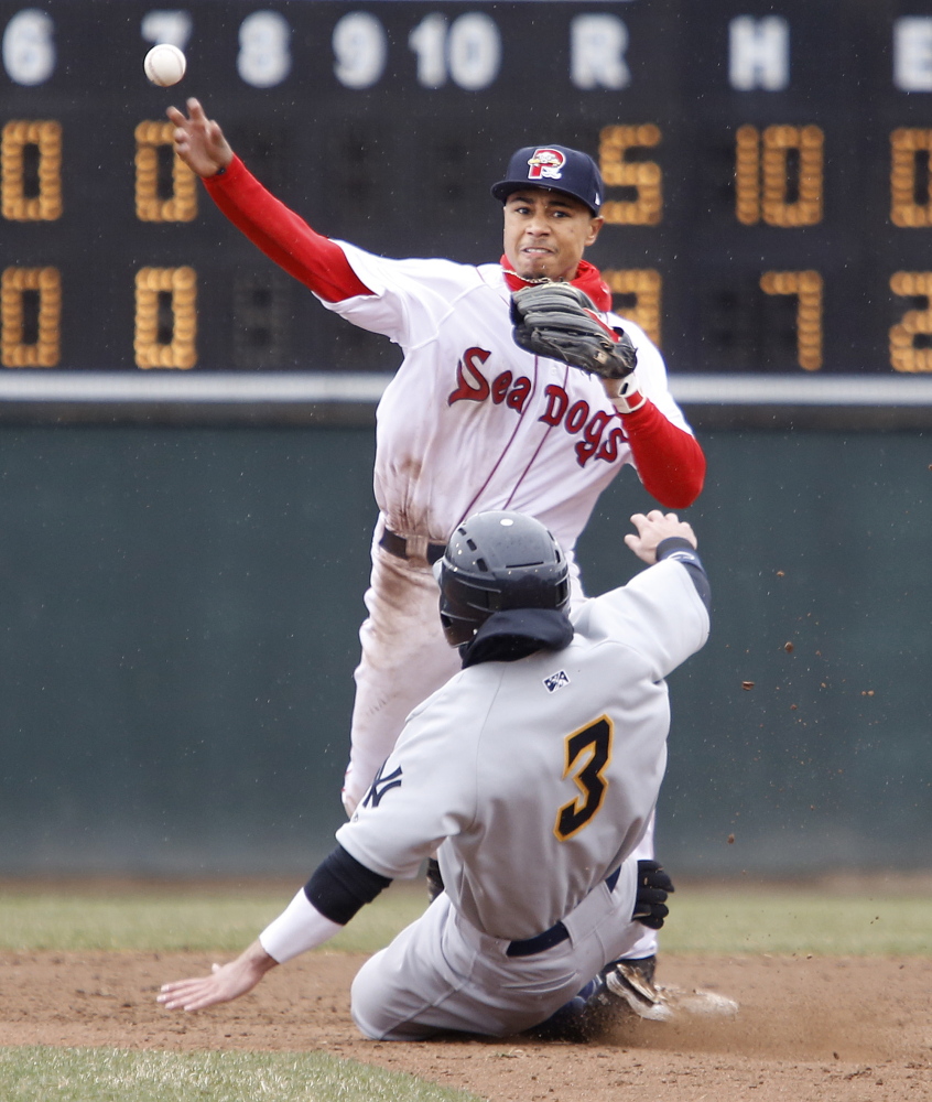 Second baseman Mookie Betts makes the pivot and fires to first to complete a double play after forcing Taylor Dugas of the Trenton Thunder in the eighth inning.