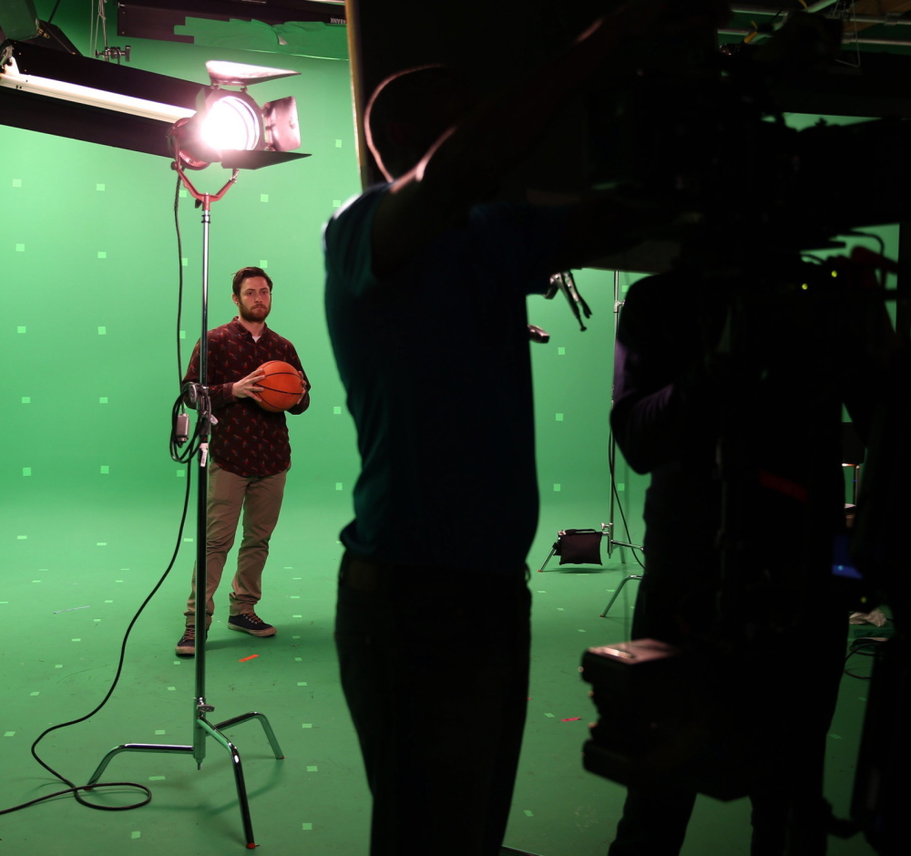 A video team preps for a shoot at Onion Labs, built in 2012 to create custom commercials reflecting The Onion’s comedic sensibility.