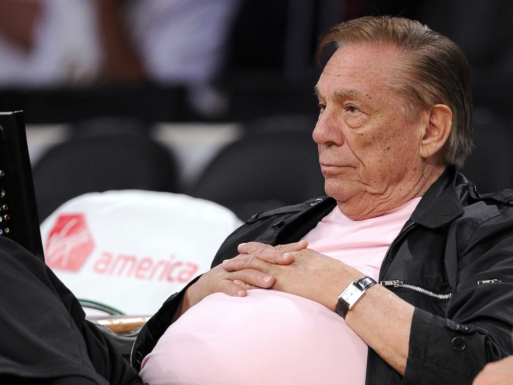 In this Oct. 17, 2010 file photo, Los Angeles Clippers team owner Donald Sterling watches his team play in Los Angeles. The NBA is investigating a report of an audio recording in which a man purported to be Sterling makes racist remarks while speaking to his girlfriend. NBA spokesman Mike Bass said in a statement Saturday, APril 26, 2014, that the league is in the process of authenticating the validity of the recording posted on TMZ’s website. Bass called the comments “disturbing and offensive.”