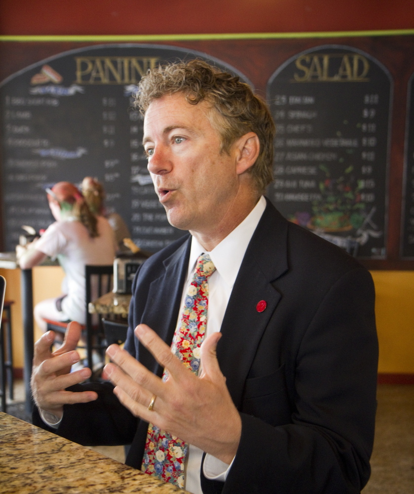 Sen. Rand Paul of Kentucky answers questions during an interview at Giacomo’s coffee shop in Bangor on Saturday.