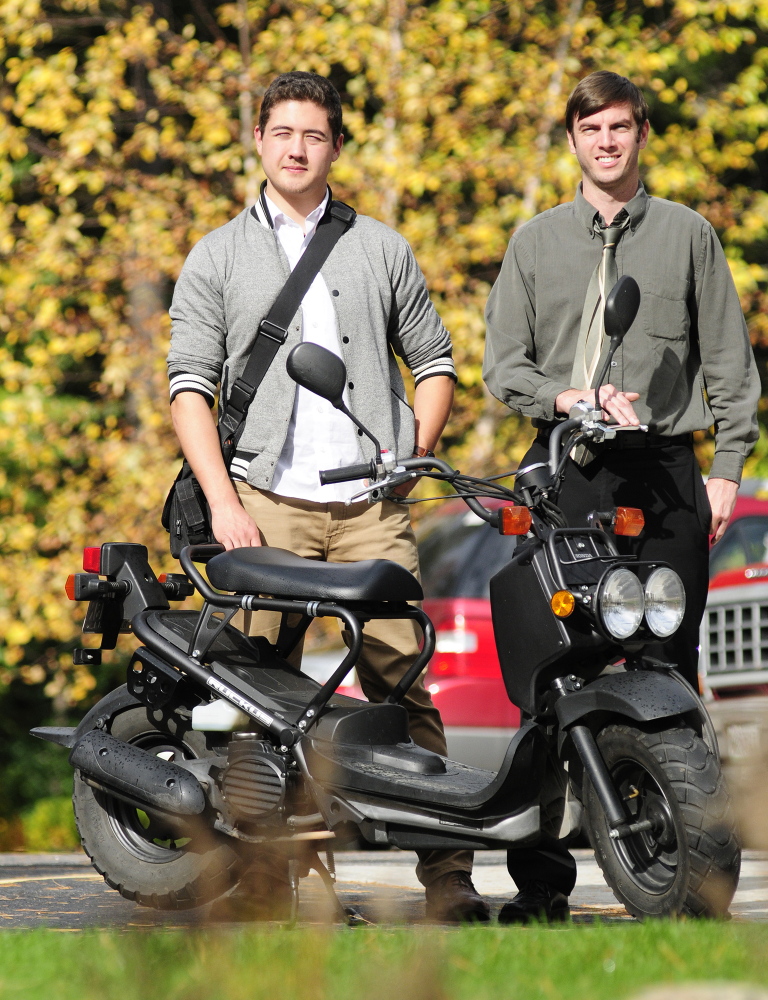 Myles Chung and Dan Emery stand with a Honda Ruckus in October in Augusta, three months before beginning their cross-country journey.