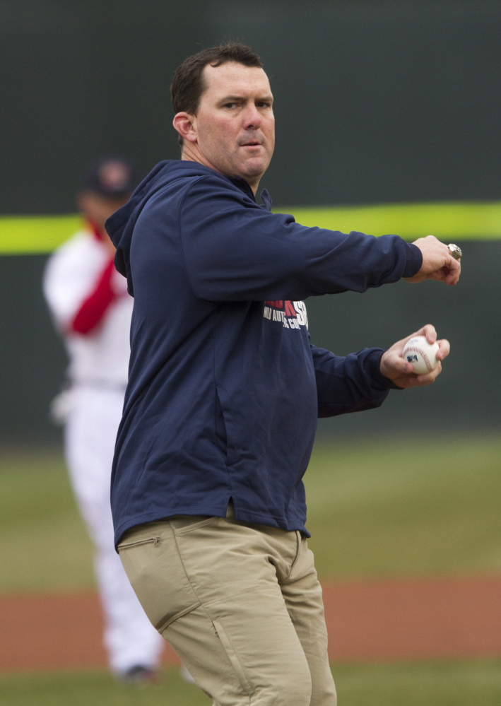 Former Red Sox right fielder Trot Nixon throws out the first pitch for the Portland Sea Dogs at Hadlock Field on Monday. Portland got a strong outing from Mike McCarthy, who won his first game of the year.