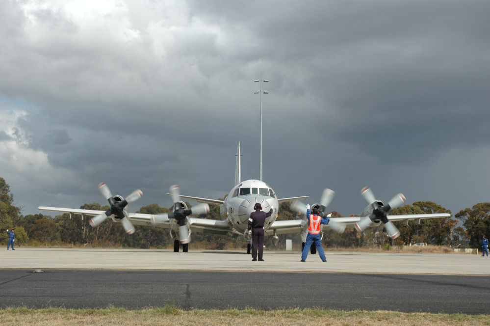 A Japanese P-3C Orion is guided by ground crew as it taxis along the tarmac at RAAF Base Pearce before departing on Japan's final search flight for the missing Malaysia Airlines flight on Monday.