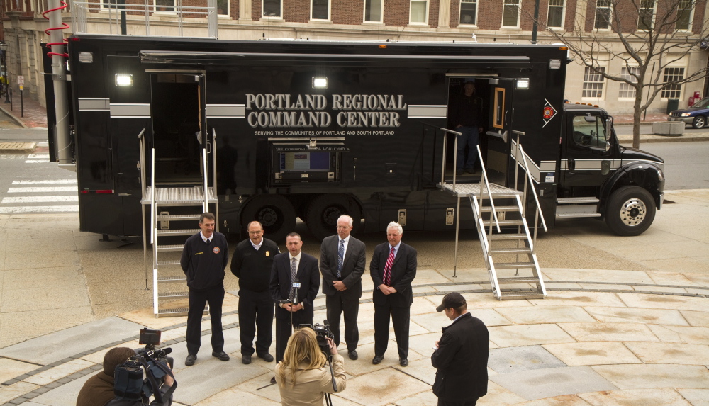 Portland and South Portland officials take questions at City Hall plaza in Portland Monday while discussing the benefits of a new Regional Command Vehicle for the two cities. The vehicle cost about $400,900 and has another $60,000 in radio and computer gear.