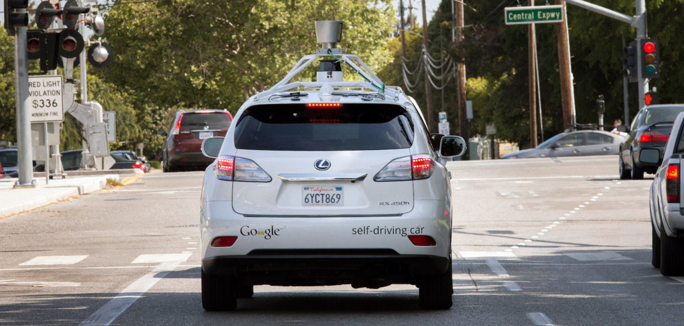 A photo provided by Google shows the company’s self-driving car navigating along a street in Mountain View, Calif., last week. The director of Google’s self-driving car project wrote in a blog post Monday that development of the technology has entered a new stage: trying to master driving on city streets.