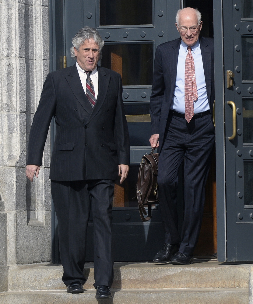 Maine attorney Gary Prolman, left, leaves U.S. District Court in Portland with his attorney, Peter DeTroy, on Tuesday, after Prolman pleaded guilty to a federal charge of money laundering.