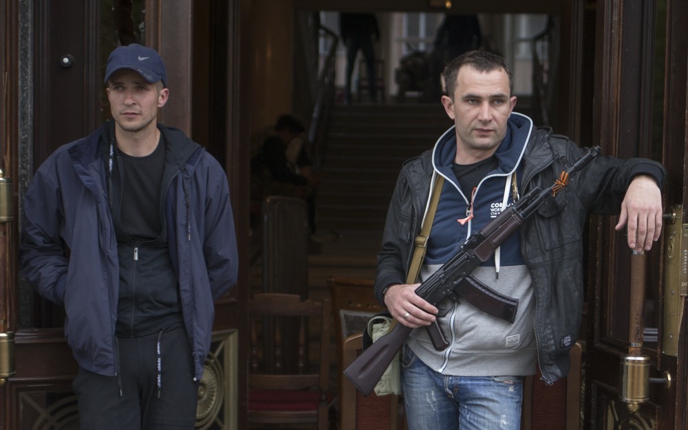 Pro-Russian activists guard the captured administration building in the center of Luhansk, Ukraine on Tuesday.