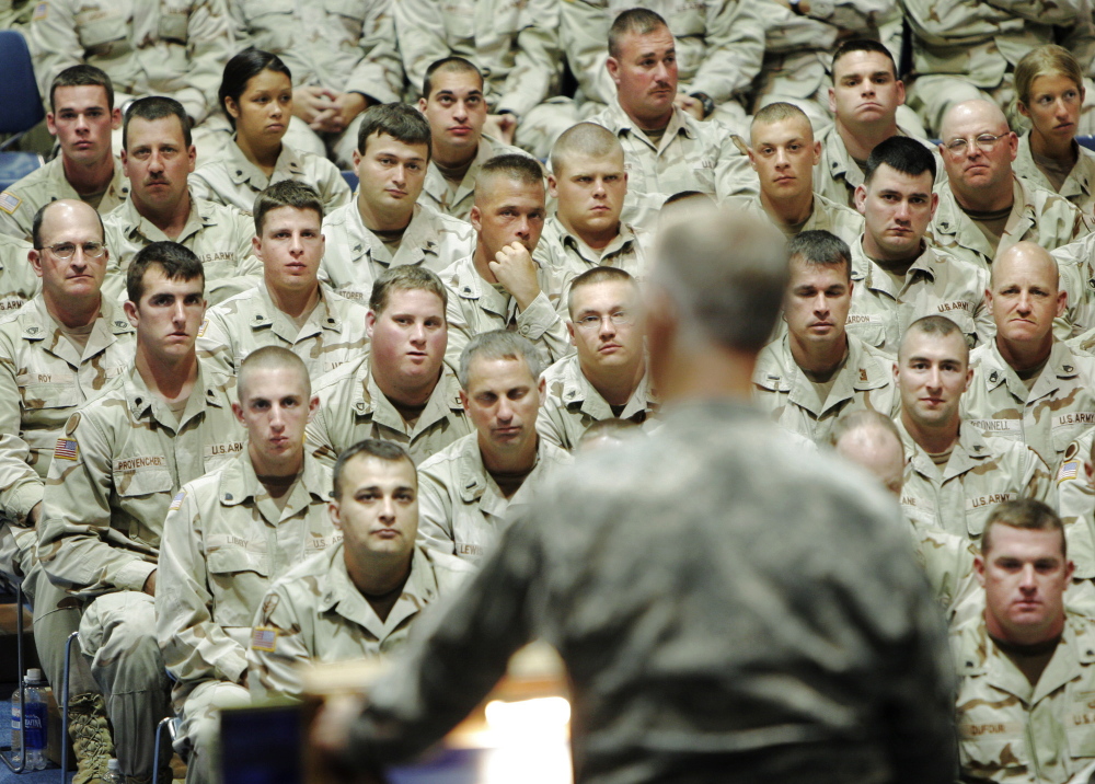 Soldiers from Company C, 133rd Engineer Battalion of the Maine Army National Guard listen to Gen. John Libby speak during a freedom salute ceremony at the Augusta Civic Center in 2005.