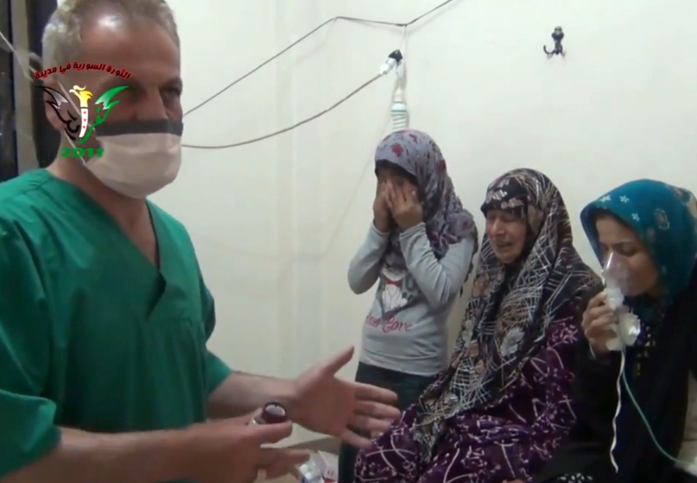 A medic treats people in Kfar Zeita, a rebel-held village in Hama province, in Syria, on April 18.