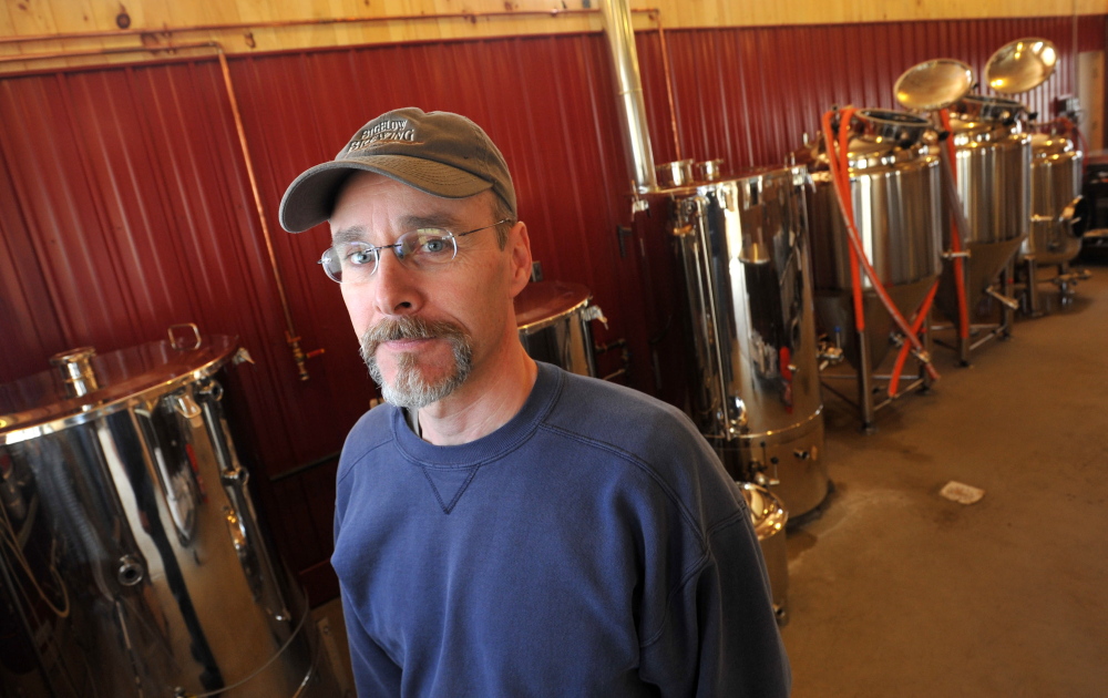 Jeff Powers, owner of Bigelow Brewing Company, stands among his vats in his brewery in Skowhegan on Tuesday. Bigelow Brewing Company has an open house on Saturday at the 473 Bigelow Hill Road location and will be offering free samples.