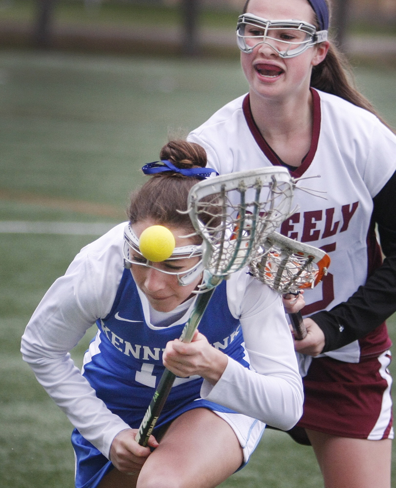 Sophie Joseph of Kennebunk works to gain possession in front of Eliza McKenney of Greely during the first half at North Yarmouth Academy. Kennebunk opened a 7-2 halftime lead and never was seriously threatened.
