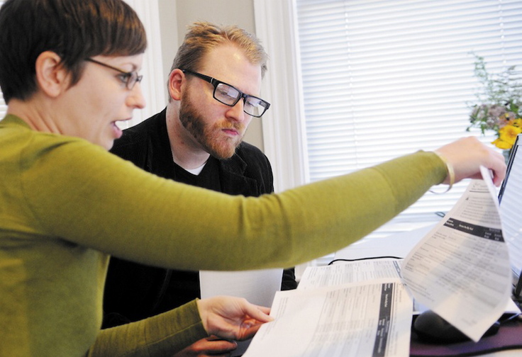 In this October 2013 file photo, Emily Brostek assists Jesse Miller of Portland in learning about health insurance options under the Affordable Care Act Harvard Pilgrim Health Care will likely insure Mainers in the federal health insurance marketplace next year, according to company officials.