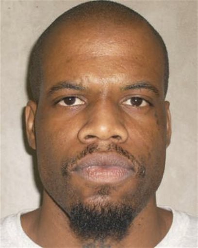 This 2011 photo provided by the Oklahoma Department of Corrections shows Clayton Lockett. Oklahoma prison officials halted the execution of Lockett Tuesday after the delivery of a new three-drug combination failed to go as planned.