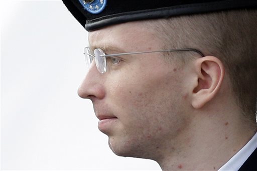 Army Pfc. Bradley Manning, who now is known as Chelsea Manning, is escorted to a security vehicle in Fort Meade, Md., after a hearing in his court-martial, in this Aug. 20, 2013, photo.