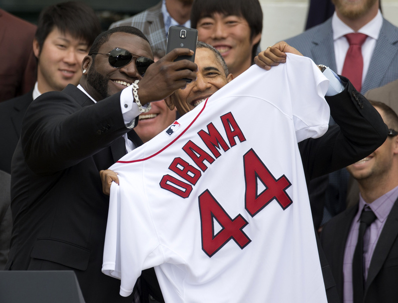 Boston Red Sox player David "Big Papi" Ortiz takes a selfie with President Barack Obama while holding a Boston Red Sox jersey presented to the president at the White House on Tuesday. Obama's jersey number reflects that he's the 44th president.