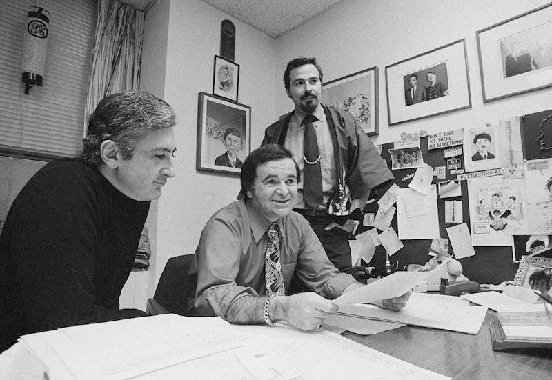 In this 1972 file photo, Mad magazine editor Al Feldstein, center, sits with art director John Putnam, left, and a freelancer named Jack, at the magazine's New York headquarters.