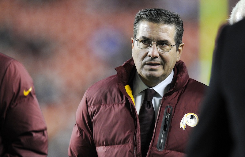 In this December 2013 file photo, Washington Redskins owner Dan Snyder walks off the field before an NFL football game. Snyder said Tuesday, April 22, 2014, it's time for people to "real issues" concerning Native American matters instead of criticizing the team's nickname.