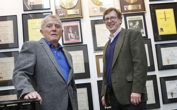 MECA President Don Tuski, right, and Dan Crewe, brother of songwriter Bob Crewe, stand in front of memorabilia from Bob Crewe’s career in Cumberland. The collection will be displayed at MECA as part of a new art and music program.