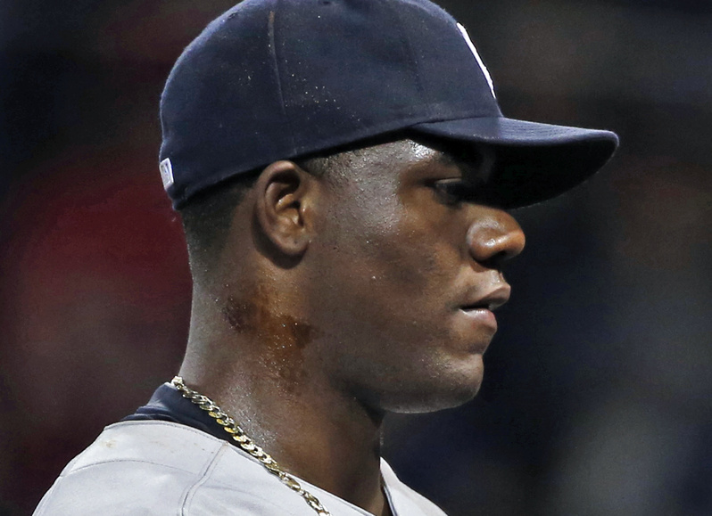 New York Yankees starting pitcher Michael Pineda walks to the dugout after he was ejected when a foreign substance was found on his neck in the second inning of a baseball game against the Boston Red Sox at Fenway Park in Boston on Wednesday. Fenway Park