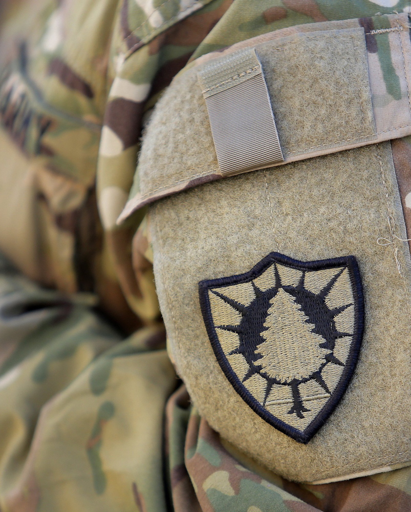 Sgt. Jessica Kurka of Durham wears the 133rd’s pine tree patch at an airfield in Afghanistan last year.