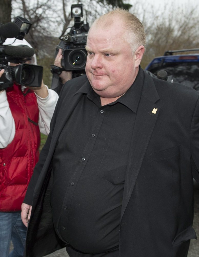 Rob Ford leaves his home early Thursday in Toronto. A second video reportedly shows him smoking crack.