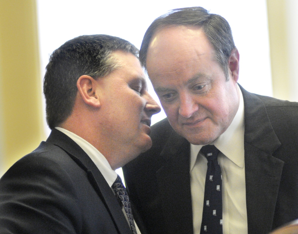 Senate Minority Leader Michael Thibodeau, R-Winterport, left, confers with Sen. Andre Cushing, R-Hampden, in Augusta Thursday, a day filled with voting on vetoed bills.