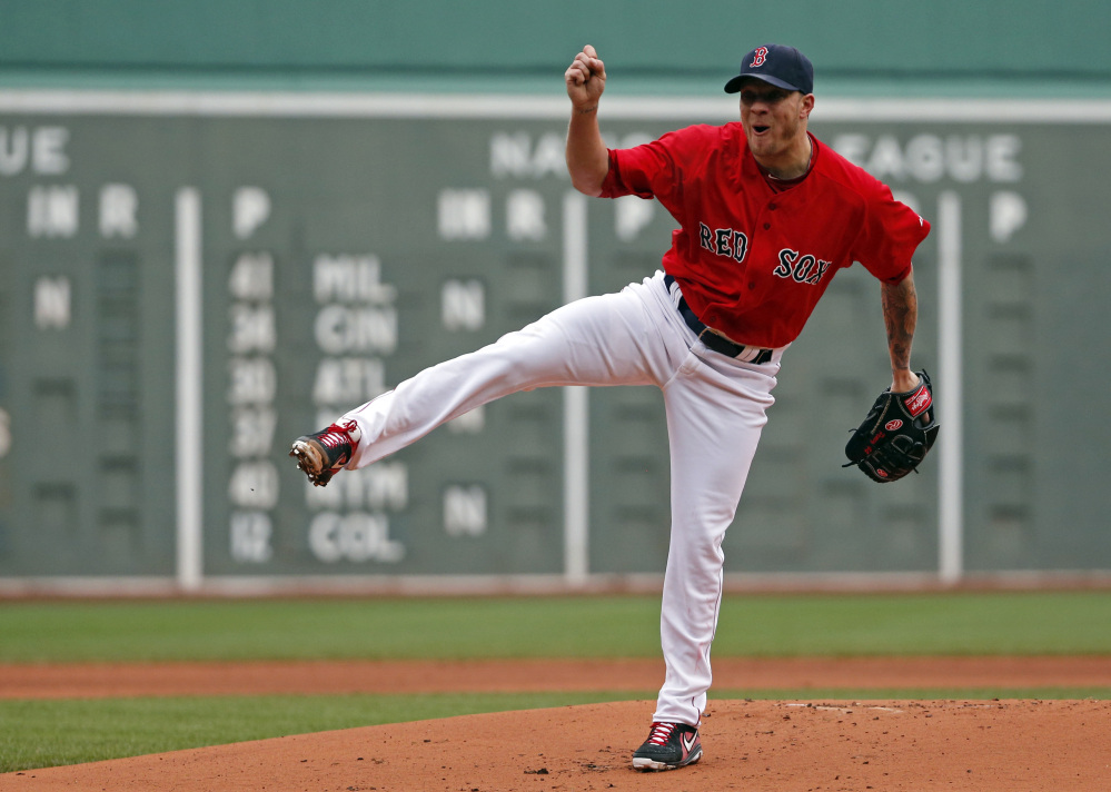 Boston Red Sox starting pitcher Jake Peavy delivers to the Tampa Bay Rays in the first inning in the first game of a doubleheader at Fenway Park on Thursday.