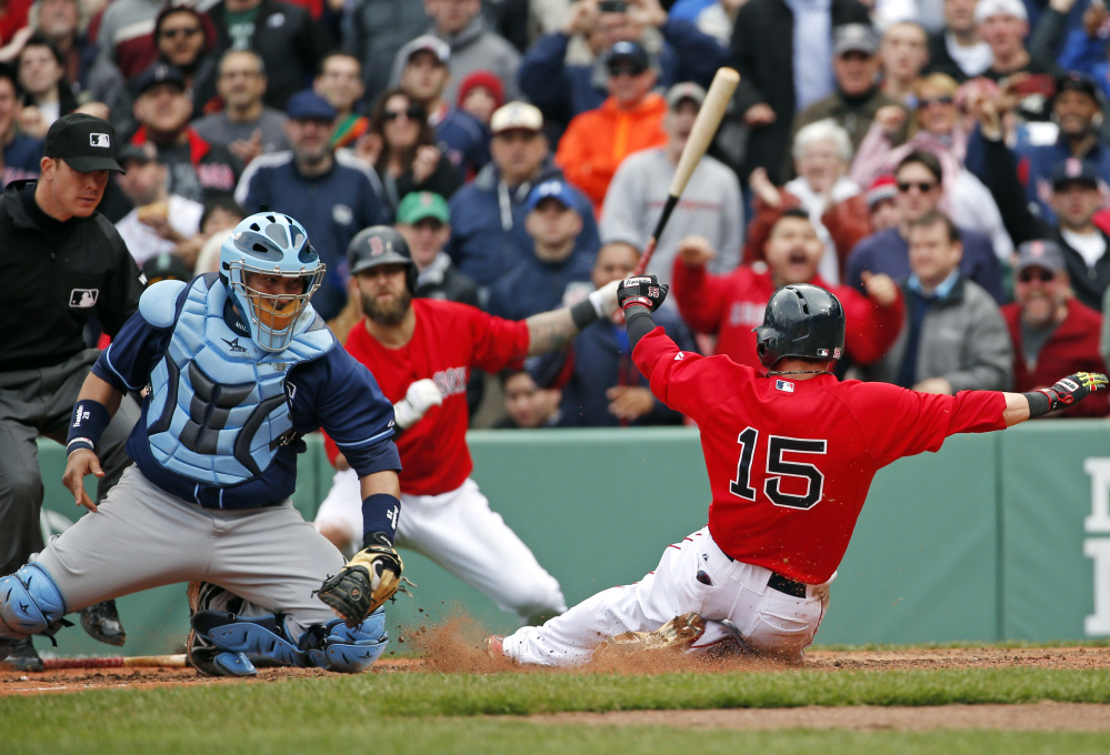 Tampa Bay Rays catcher Jose Molina moves to tag out Red Sox second baseman Dustin Pedroia who was trying to score on a double by David Ortiz in the seventh inning in the first game of a doubleheader at Fenway Park on Thursday.