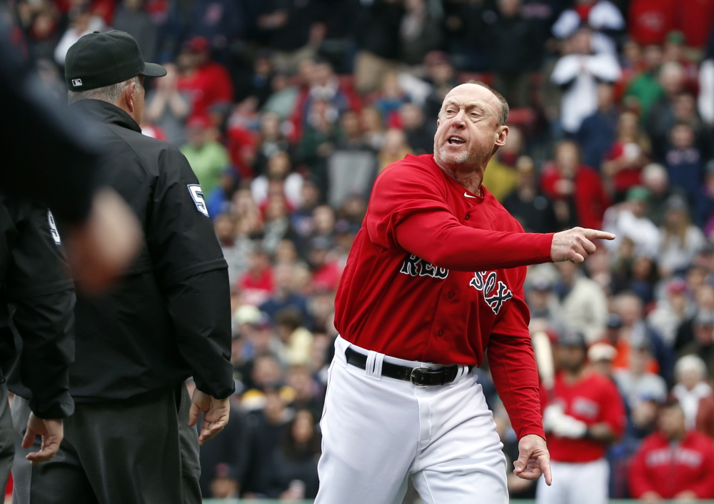 Boston Red Sox third base coach Brian Butterfield argues with umpires after they called Red Sox second baseman Dustin Pedroia out at home plate trying to score on a double by David Ortiz in the seventh inning in the first game of a doubleheader against the Tampa Bay Rays on Thursday.