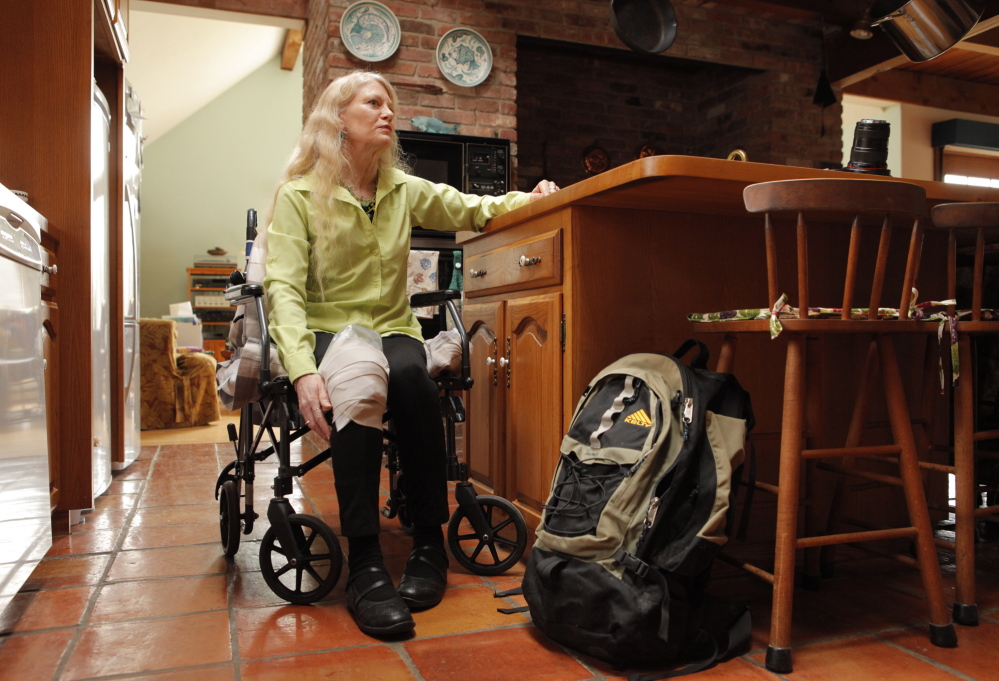 Eileen Whynot uses a wheelchair to get around her Gorham home on Tuesday, April 29, 2014 while she recovers from a ski accident that broke her pelvis. Whynot had to have surgery after the accident and is grateful to have health insurance through the Affordable Care Act.