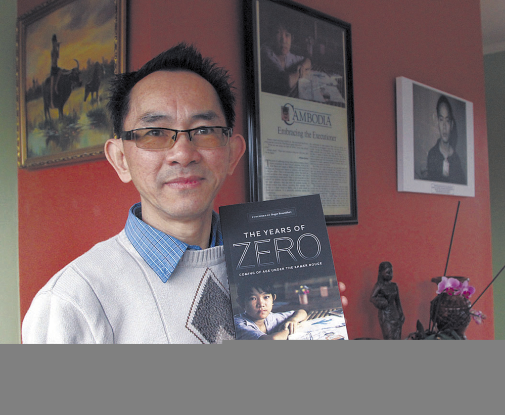 Seng Ty poses with his self-published book, “The Years of Zero, Coming of Age Under the Khmer Rouge.”