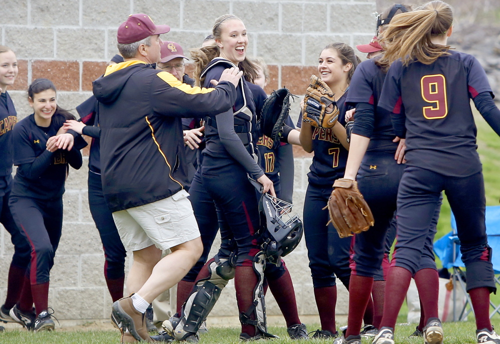 Cape Elizabeth players and coaches celebrate after the Capers ended a Fryeburg Academy threat with a good defensive play during their 5-1 victory Saturday in a Western Maine Conference softball game at Cape Elizabeth.