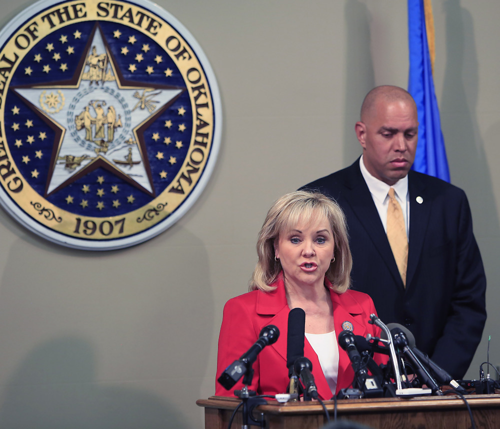 Oklahoma Gov. Mary Fallin issues a statement Wednesday on the execution of Clayton Lockett as Oklahoma Secretary of Safety and Security Michael C. Thompson listens.