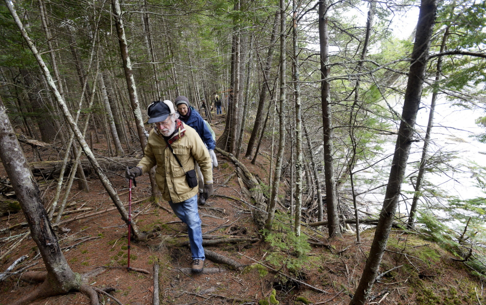 Jon Rosenthal of Damariscotta and other members of the Wednesday Walkers hike along the Great Salt Bay Heritage Trail in Newcastle on Wednesday. Founded more than 20 years ago, the group hikes weekly from May through October.