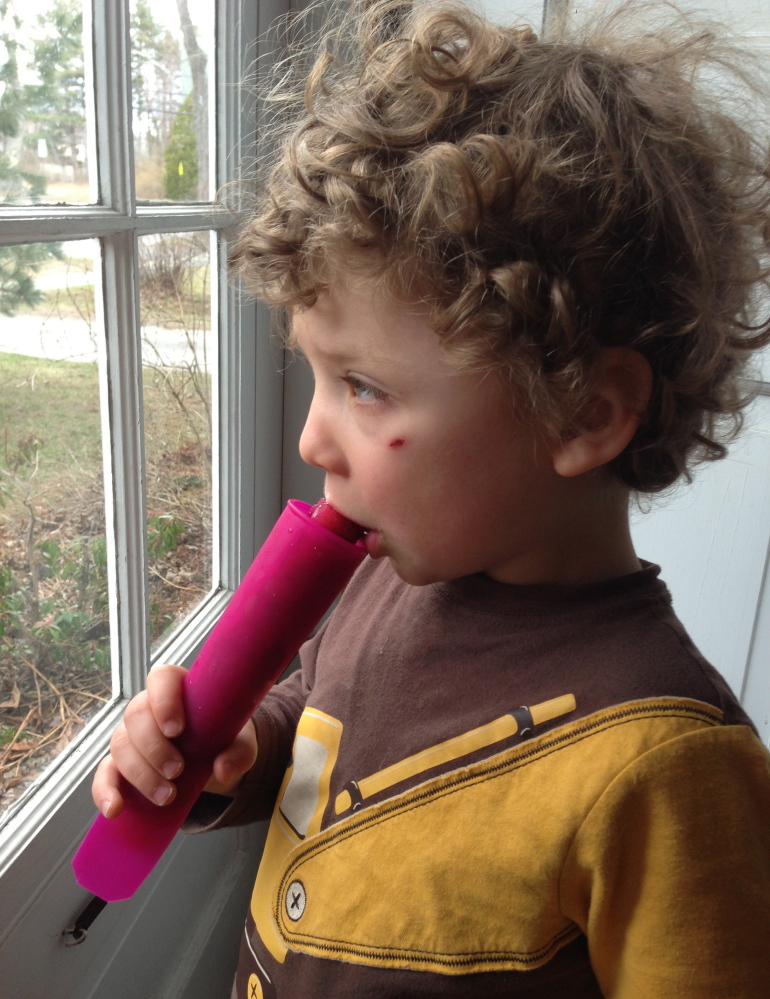The writer’s son, Theo, taste-tests rhubarb popsicles.