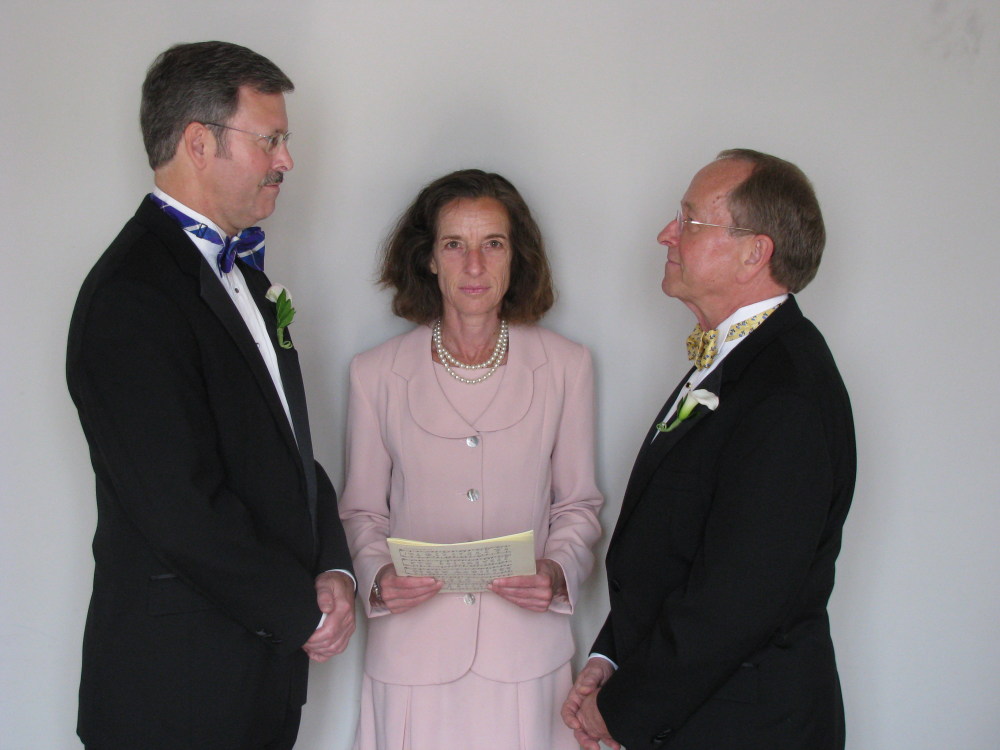 Mark Andrew, left, and Bishop V. Gene Robinson during their private civil union ceremony performed by Ronna Wise in Concord, N.H.