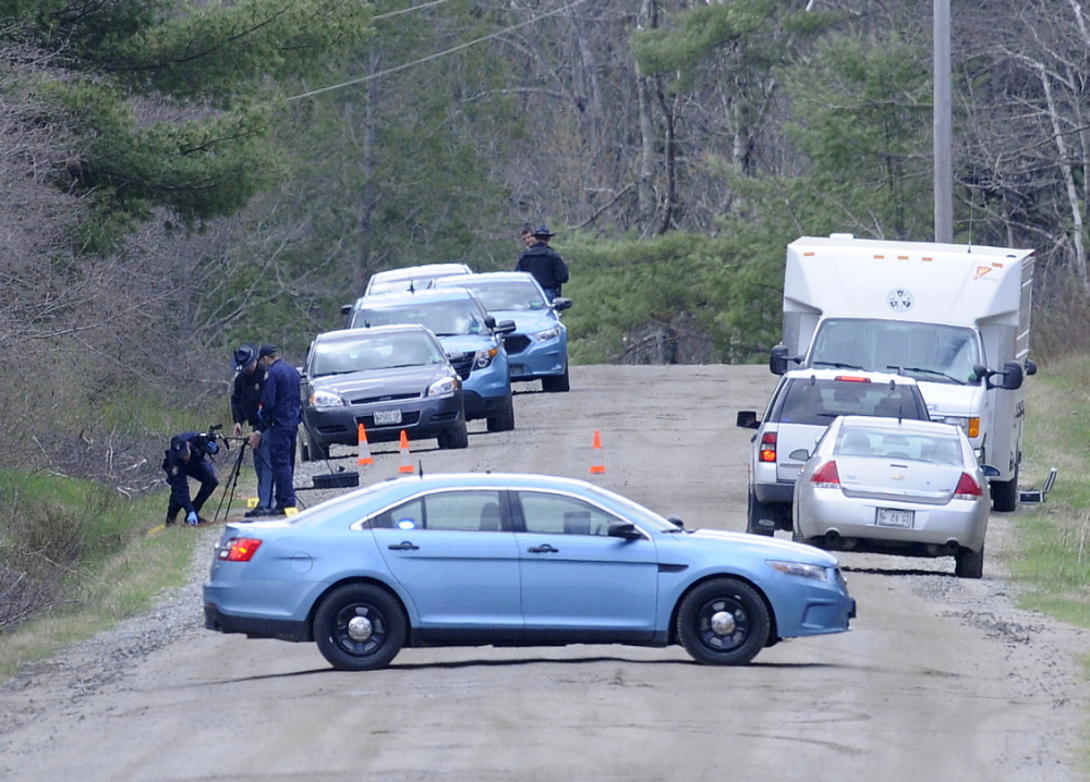 Maine State Police search a site in Richmond on Monday while investigating the death of a Gardiner man whose remains were found at the site, according to police.