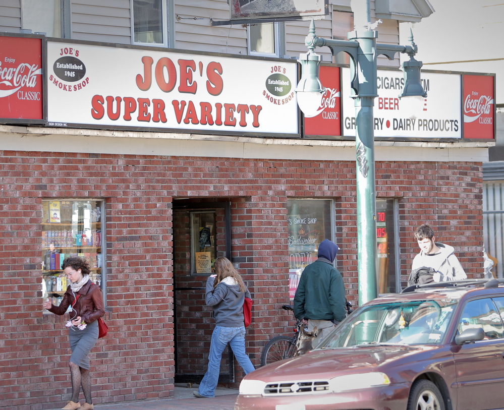 Customers enter and exit Joe’s Super Variety on Congress Street in Portland, formerly Joe’s Smoke Shop. One reason for the new name: The old one got caught up in welfare reform politics and publicity about the use of welfare benefit cards where tobacco is sold.