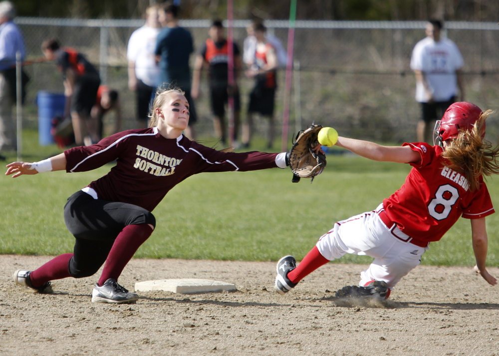Ashley Gleason of Scarborough just beats the throw to Thornton‘s Brooke Cross as Gleason earns a fifth-inning steal of second base during the Red Storm’s 5-1 win at Saco on Monday.