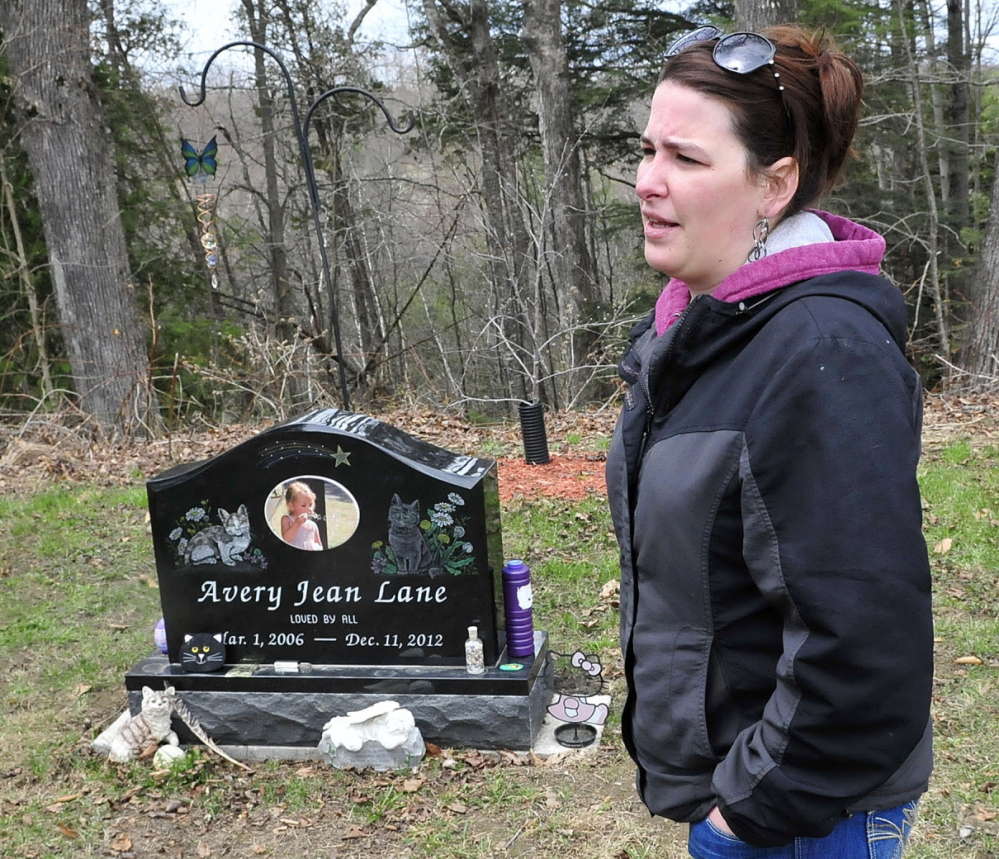 Tabitha Souzer, Avery Lane’s mother, speaks at her daughter’s grave at the Friend’s Cemetery in Fairfield on Tuesday. Souzer said the grave has been vandalized three times.