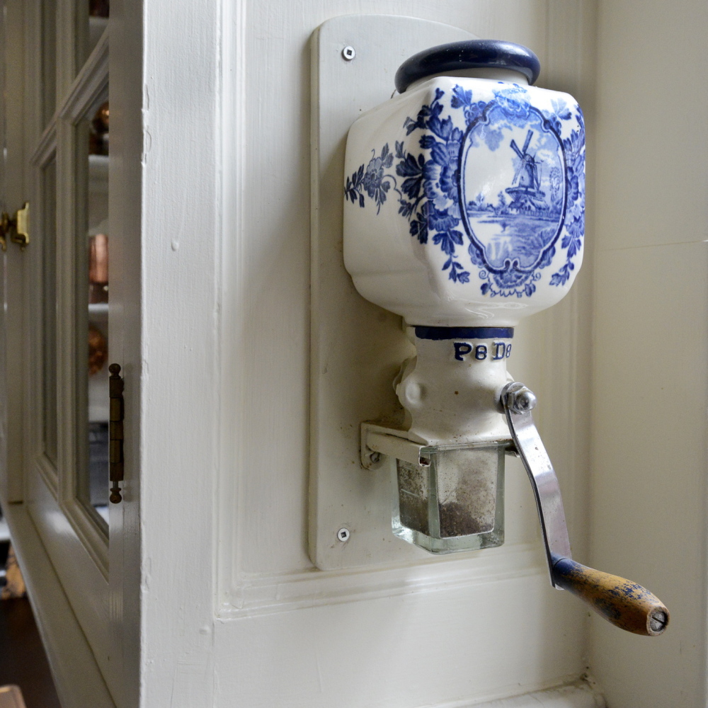 A ceramic coffee grinder affixed to a cupboard is one of the touches tour takers will see when they visit this kitchen on Portland’s Western Promenade this weekend.
