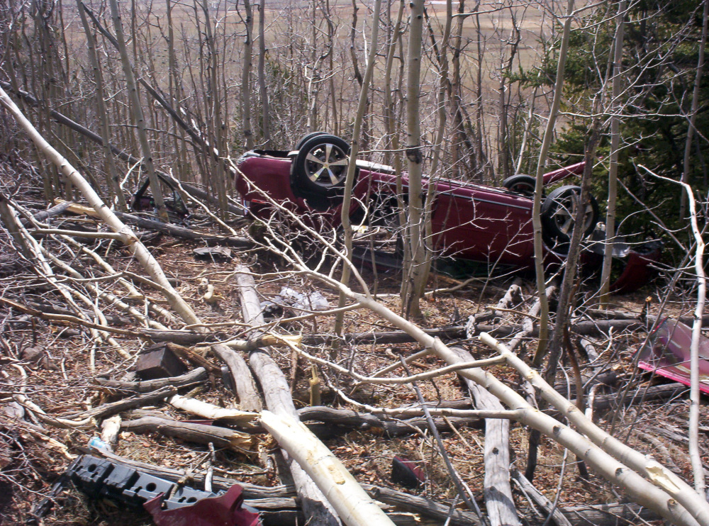 In this photo provided by the Park County Sheriffís Office, Kristin Hopkins’ car is seen after she drove off the roadway near the old mining town of Fairplay, Colo., sometime after she was last seen on April 27.