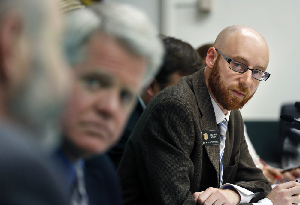 Rep. Jonathan Singer, D-Longmont, listens to discussion on a bill he sponsored which would allow marijuana dispensaries to form financial co-operatives, at the Colorado Legislature, in Denver on Wednesday.