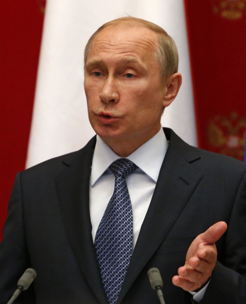 Russian President Vladimir Putin is seen at a news conference in the Kremlin in Moscow on Wednesday.
