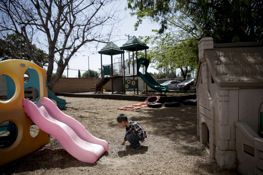 In this April 14 photo, a 3-year-old boy plays on the playground at Community Day Preschool in Garden Grove, Calif. According to the school’s executive director Sue Puisis, enrollment has dropped by more than 50 percent since 2008.