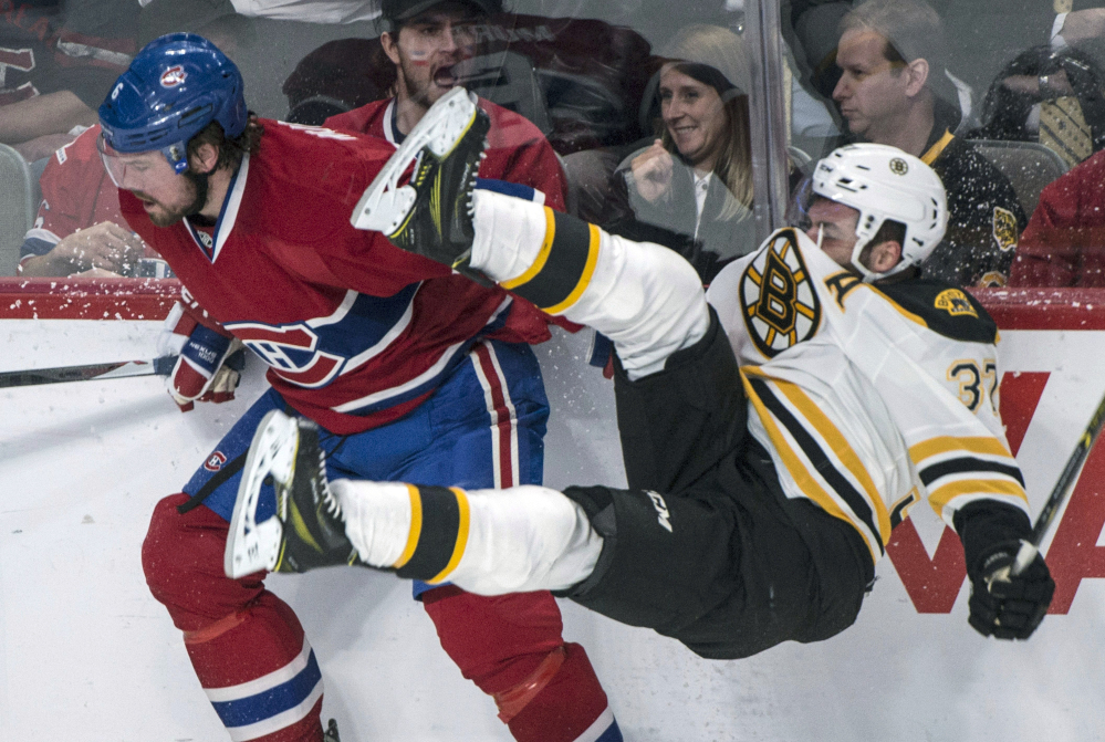 Patrice Bergeron, checked by Montreal’s Douglas Murray, and the Bruins have been upended in two of the first three games of their playoff series.