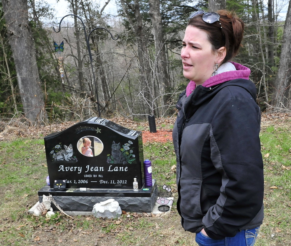Tabitha Souzer, Avery Lane’s mother, speaks at her daughter’s gravesite at the Friend’s Cemetery in Fairfield on Tuesday. Souzer said the gravesite has been vandalized three times, most recently over the weekend.