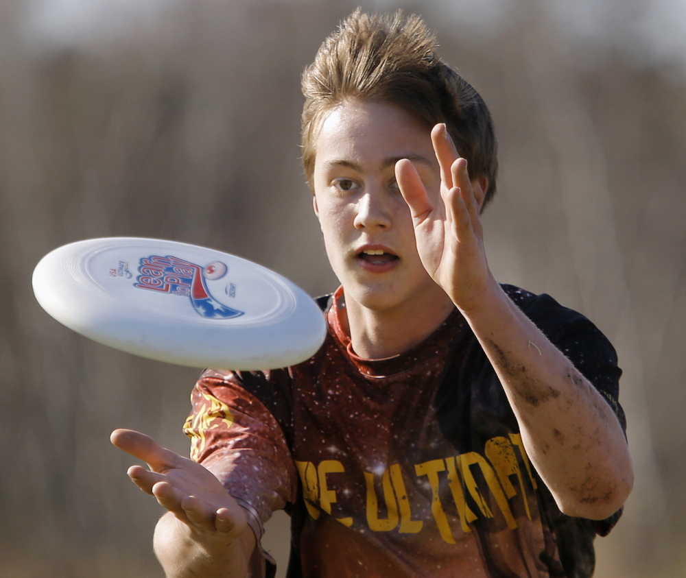Cape Elizabeth freshman Alex Depke snares the plastic disc for a score Wednesday during an ultimate game against Cumberland. Cape and Falmouth High both have boys’ and girls’ teams.