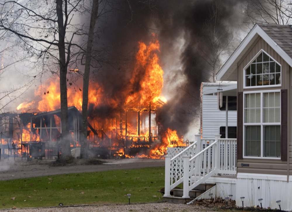 OLD ORCHARD BEACH, ME - MAY 8: A fire reportedly started by sparks from a passing train, blazes at Wagon Wheel RV Resort and Campground in Old Orchard Beach on Thursday May 8, 2014. (Photo by Carl D. Walsh/Staff Photographer)