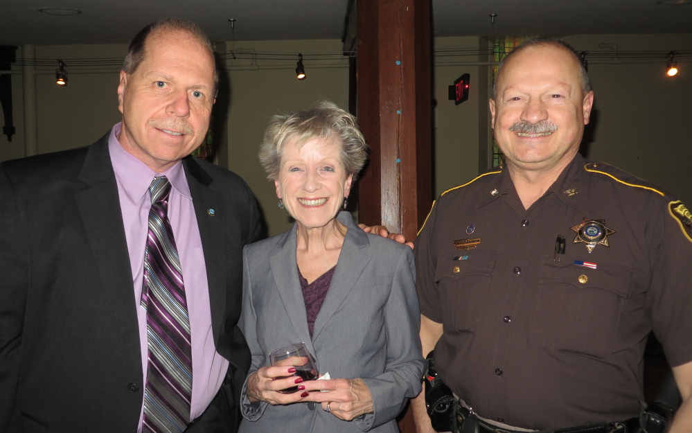 Cumberland County Sheriff Kevin Joyce of Standish, Judith Reidman of Westbrook and Cumberland County Chief Deputy Naldo Gagnon of Raymond at the Family Crisis Services benefit.